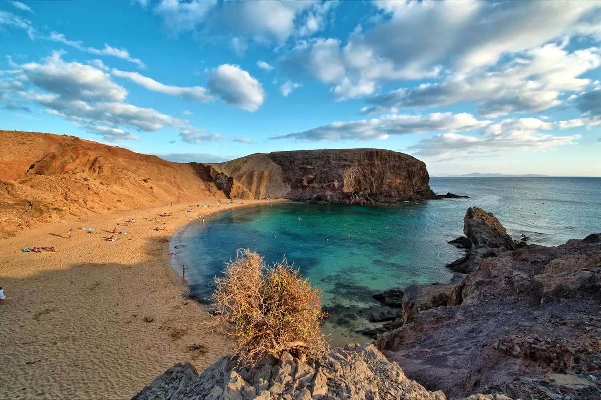 A turquoise bay at Papagayo surrounded by volcanic cliffs on Lanzarote.