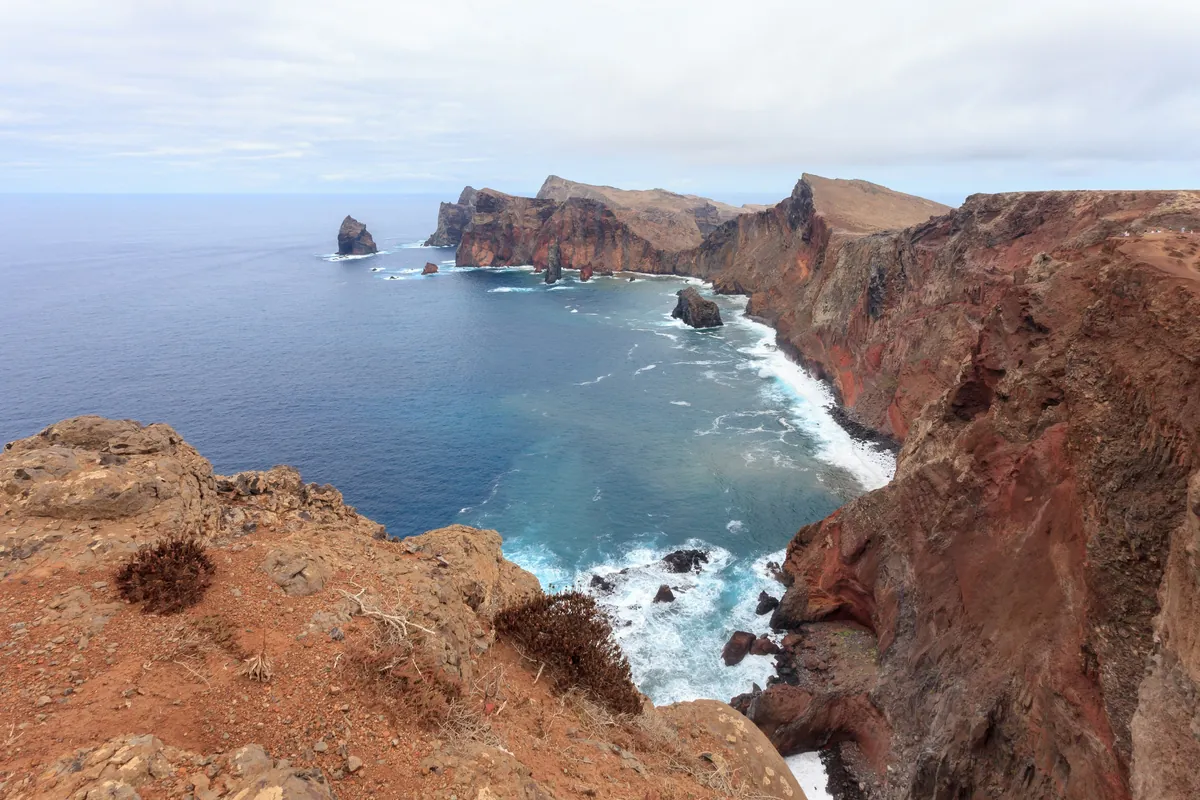 Madeira’s rocky eastern headland above blue water at Ponta de São Lourenço.