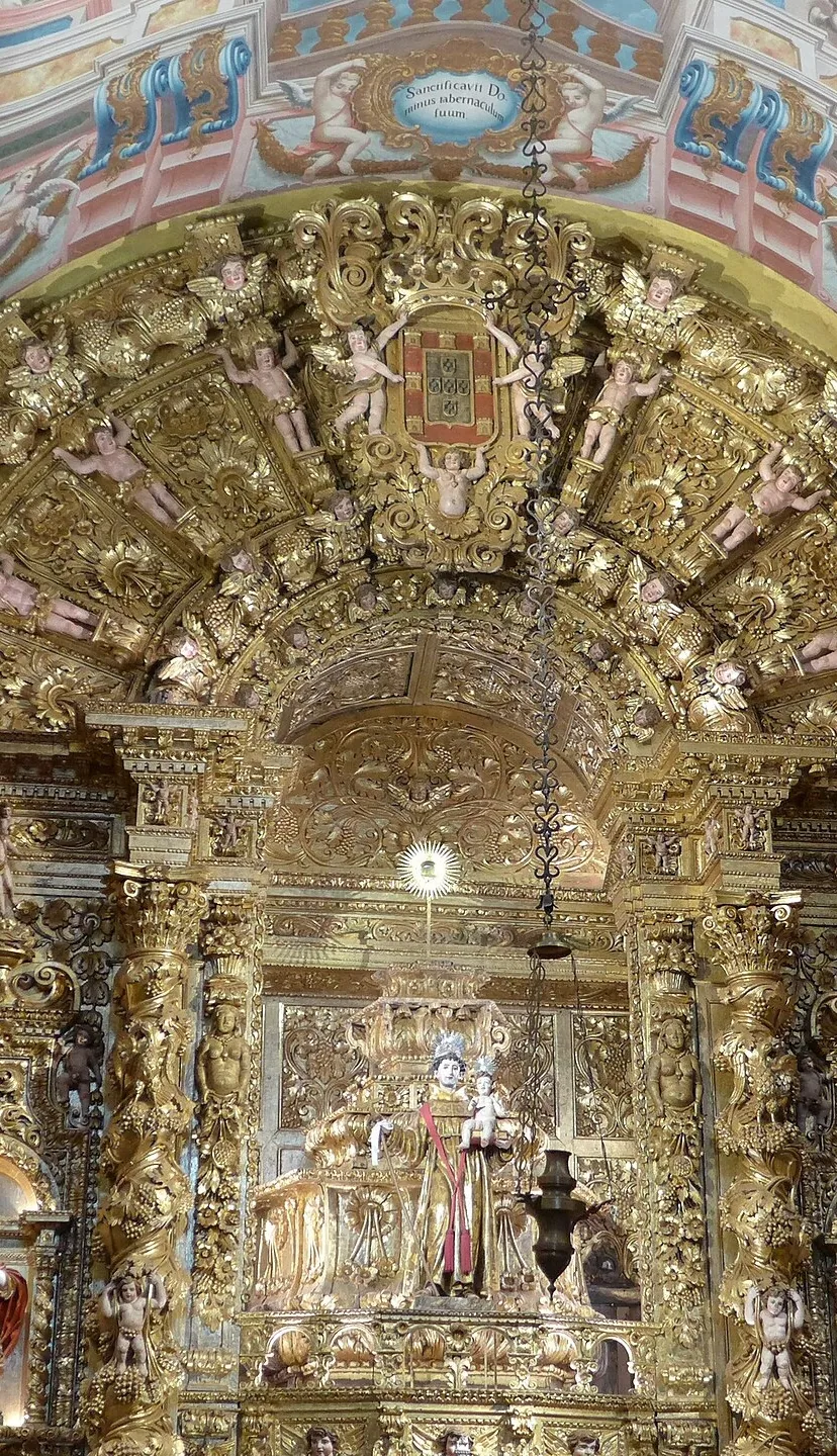 The gilded carvings, painted ceiling and altar inside Santo António church in Lagos.