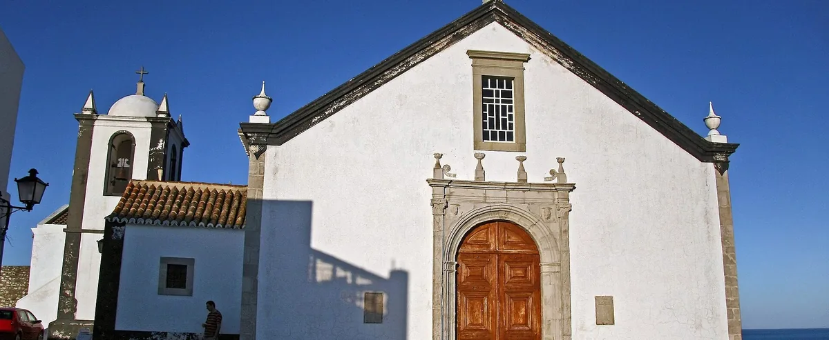 The white parish church and bell tower in Cacela Velha.