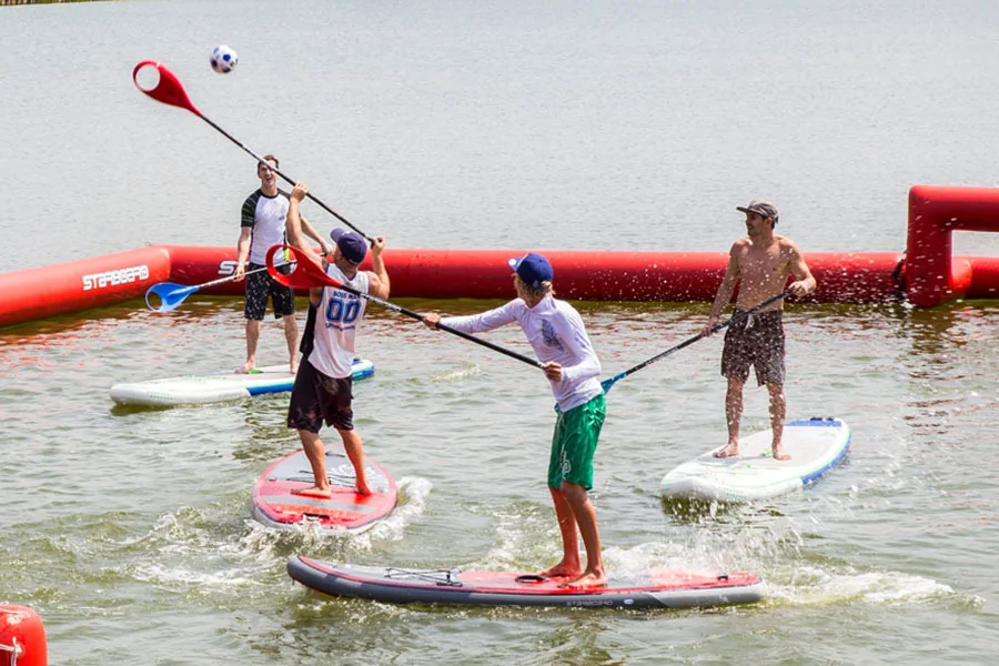 Guests taking part in SUP polo at Artur Watersports Academy.