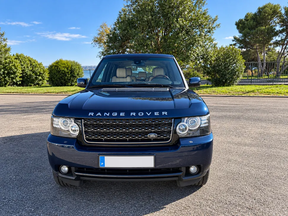 Front view of the navy Range Rover L322 in a sunny outdoor setting.