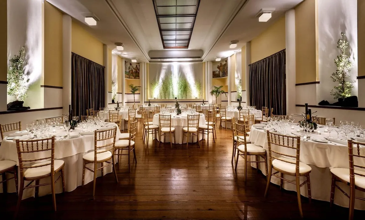 Round tables dressed for a celebration inside Casino Terra Nostra.