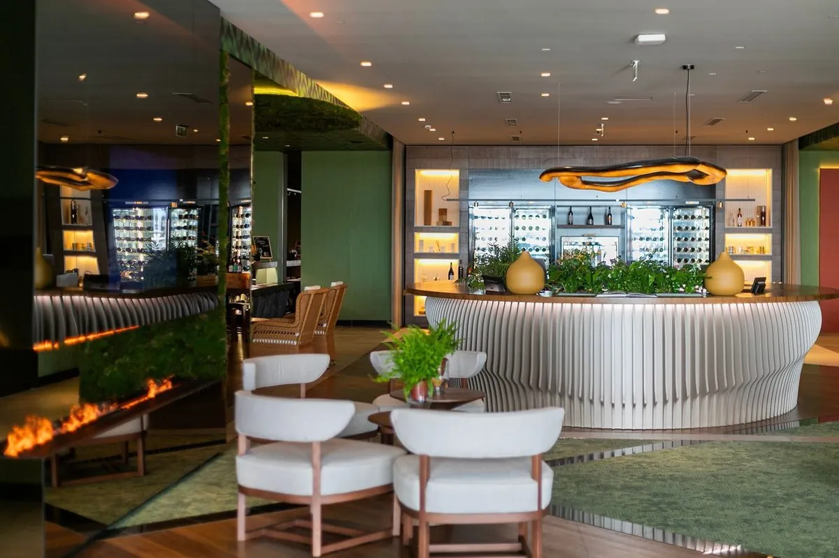 Seating beside an illuminated counter in the contemporary lobby at Octant Ponta Delgada.