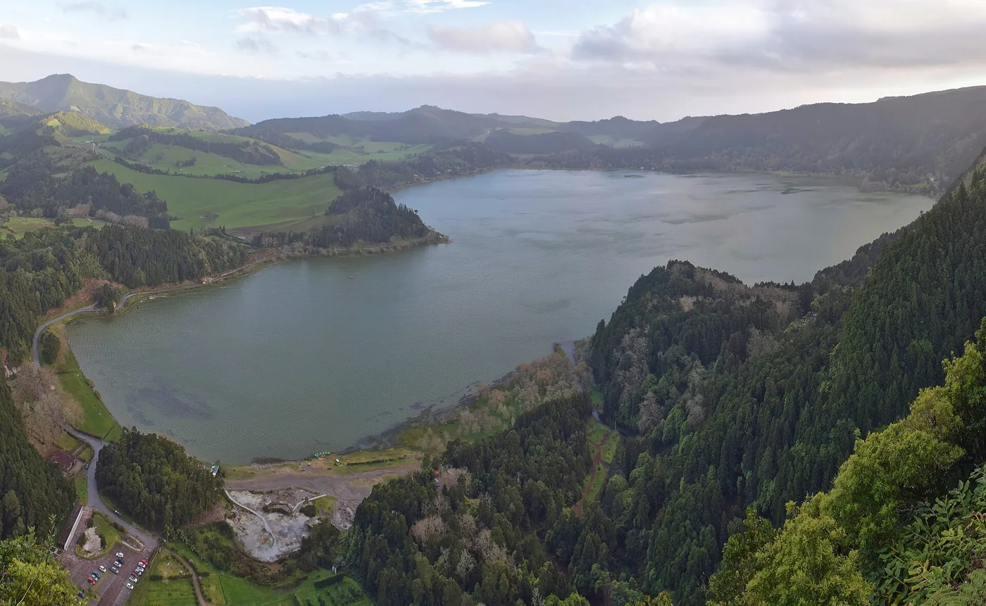 Lagoa das Furnas and green hills seen from a viewpoint.